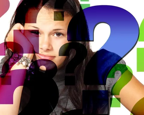 A young woman looks confused. There are question marks overlayed on the image